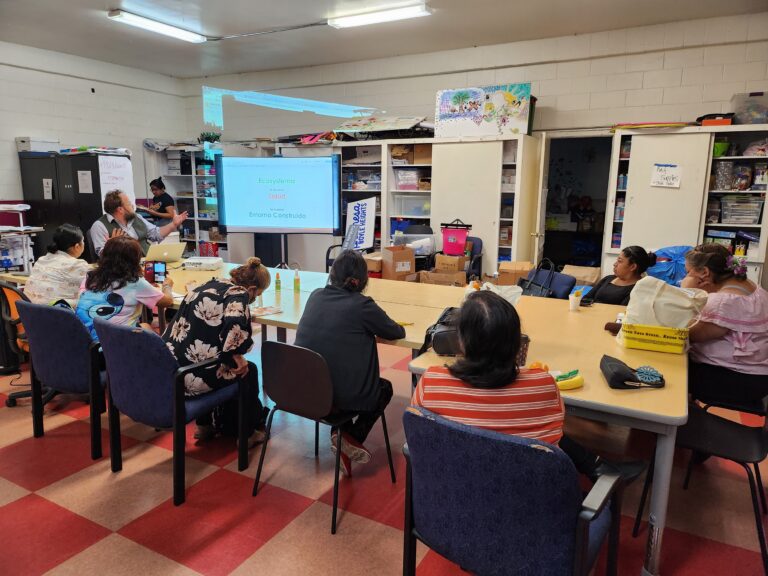 group of individuals in a classroom setting.